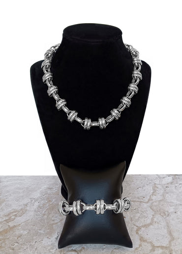 Double Ellipse Chain Necklace and Bracelet on Necklace Stand and Bracelet Pillow